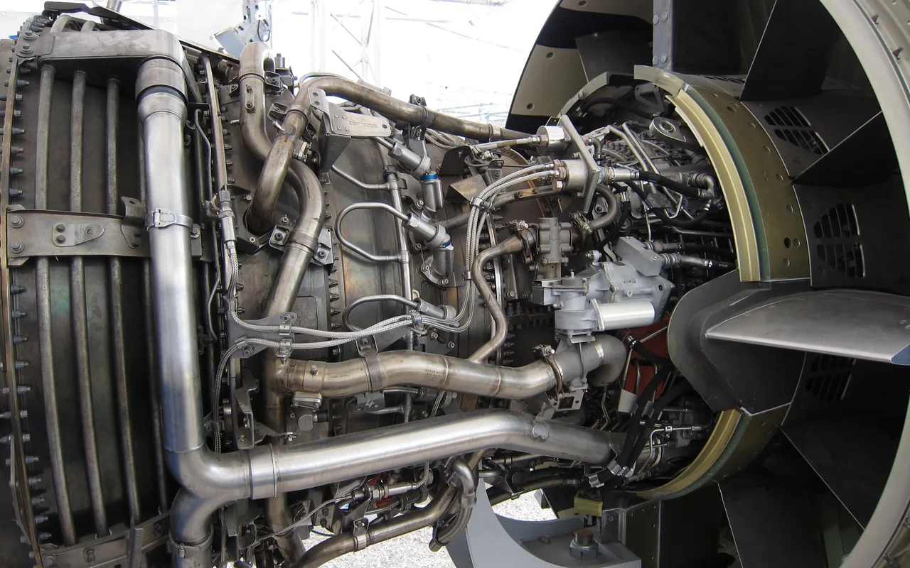 Close-up of turbofan engine components and connections.
