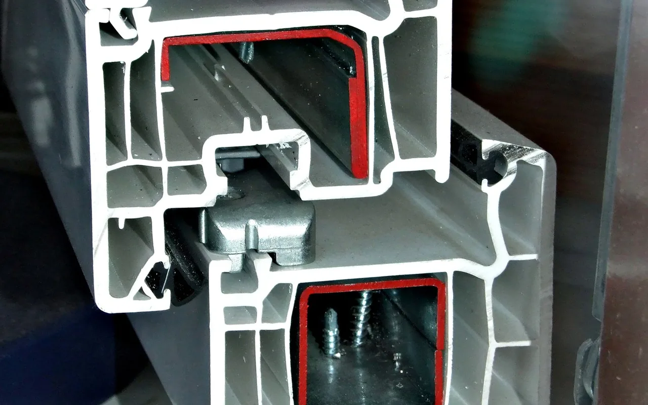 Cross-section of a multi-chamber plastic window profile.